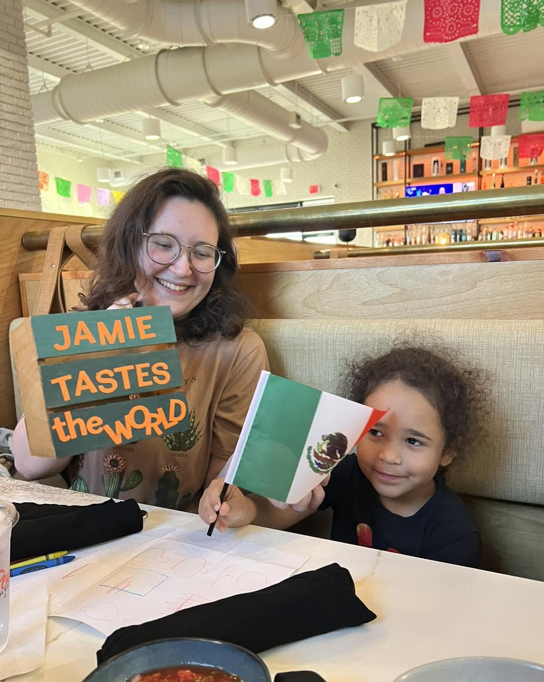 Chelsea and child with book and flag