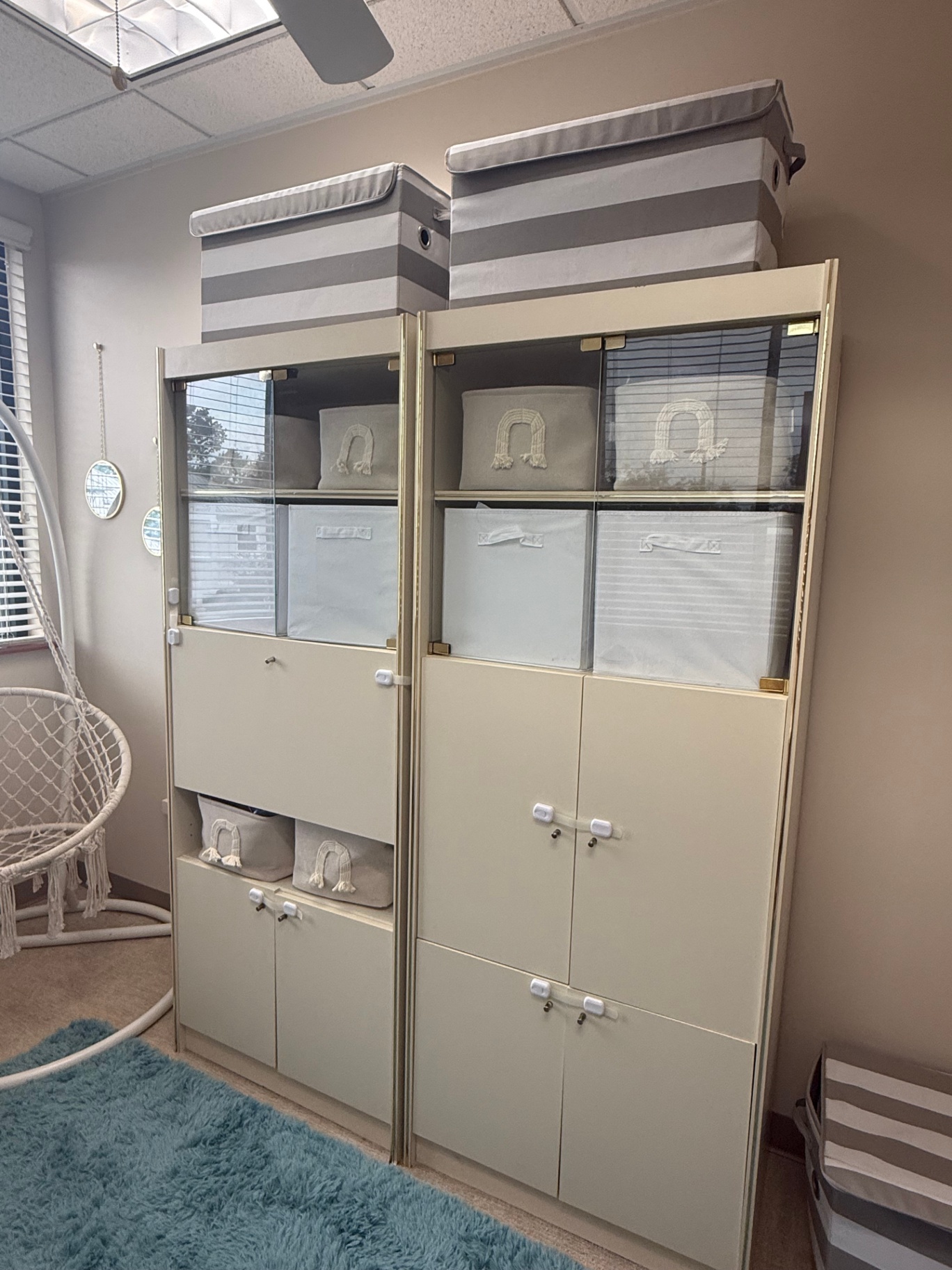 Storage cabinets stocked with therapy materials
